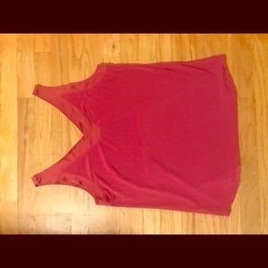 Pink tank top with vneck in front and back.